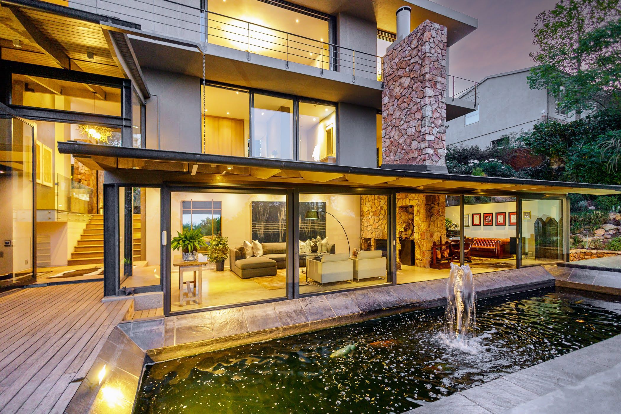 Modern waterfront development along the Tagus River in Marvila, featuring contemporary architecture and pedestrian walkways.
