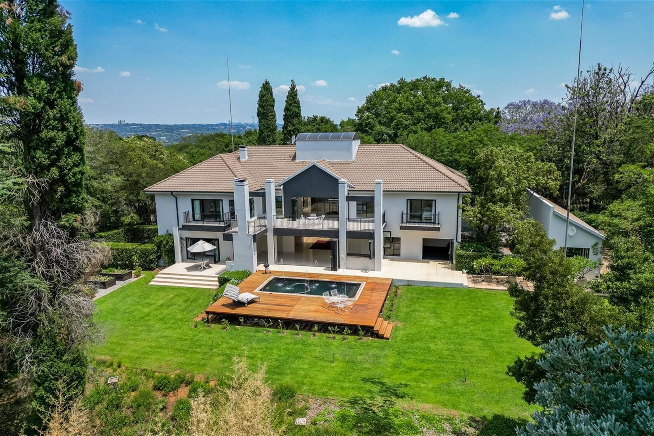 This modern and spacious double-storey four-bedroom house in Bryanston is priced at R14. 999 999 million through Pam Golding Properties. It includes a two-bedroom, one-bathroom cottage and one-bedroom, one-bathroom staff accommodation. This modern and spacious double-storey four-bedroom house in Bryanston is priced at R14. 999 999 million through Pam Golding Properties. It includes a two-bedroom, one-bathroom cottage and one-bedroom, one-bathroom staff accommodation.