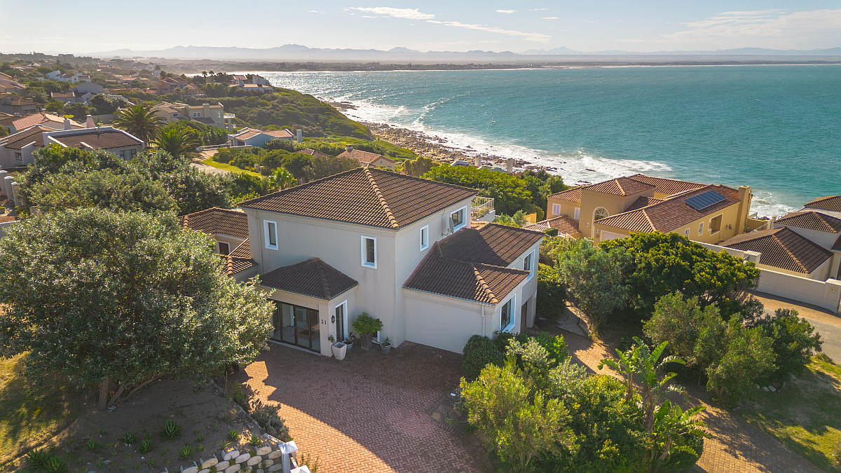 Positioned on a sought-after stretch of Tom Brown Boulevard in Santareme, this spacious, five-bedroom home on a generous double plot, offers privacy and elevated views with sweeping ocean and sea vistas, along with beautiful outlooks across St Francis Bay toward the river mouth and distant mountains. It is priced at R9.95 million through Pam Golding Properties.