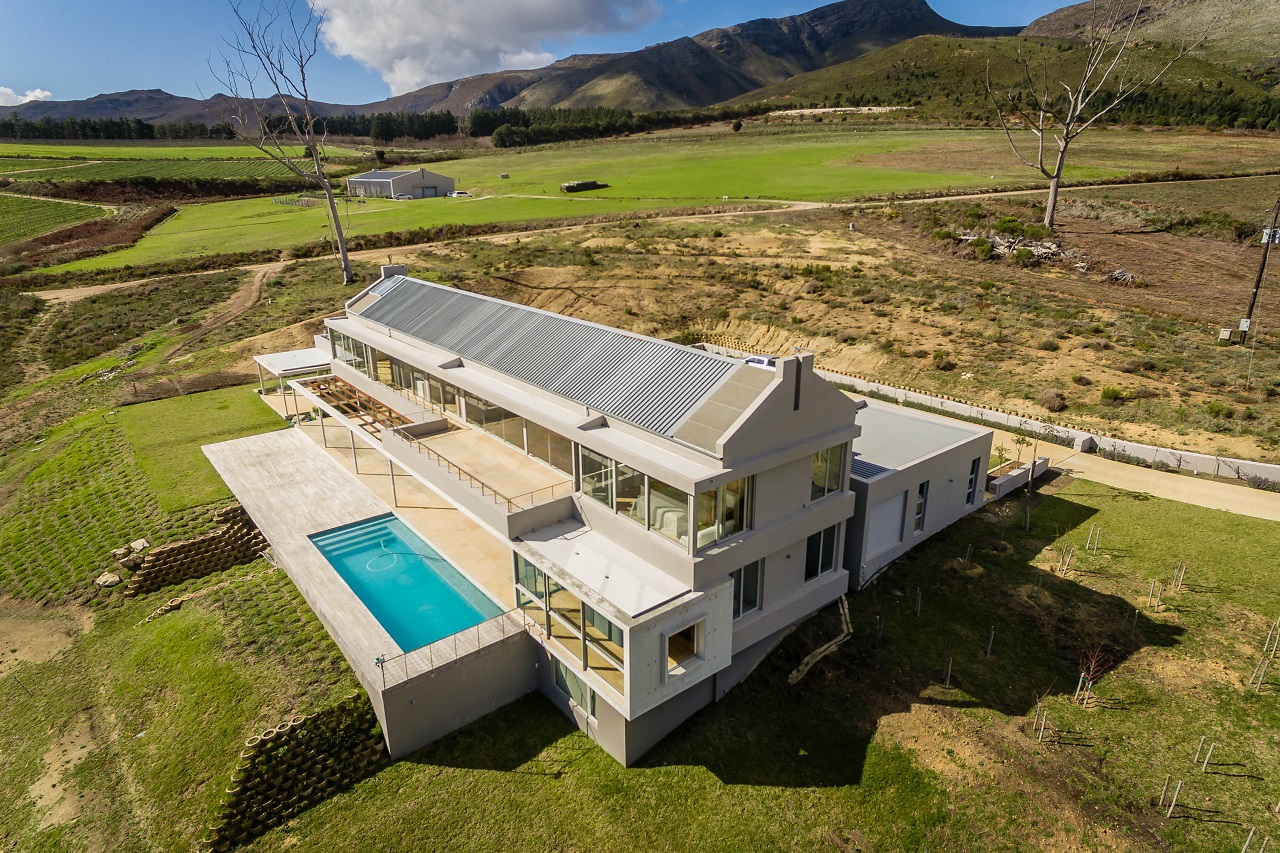 This beautiful, energy-efficient wine farm situated in the Hemel-en-Aarde Valley, is for sale through Pam Golding Properties. This beautiful, energy-efficient wine farm situated in the Hemel-en-Aarde Valley, is for sale through Pam Golding Properties.