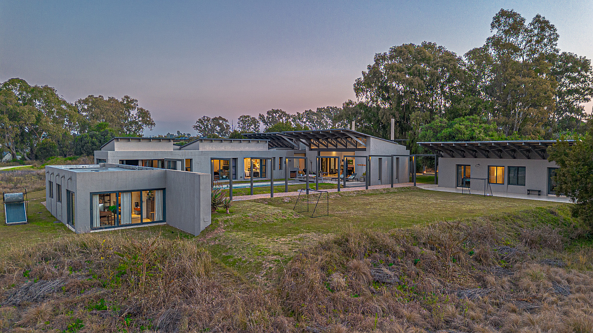 Marketed by Pam Golding Properties at R9.9 million, this 687sqm home is set on a 4037sqm stand in Monaghan Farm and offers five bedrooms and 5.5 bathrooms. Immersed in nature, its design creates a warm, welcoming atmosphere with effortless indoor-outdoor living and a relaxed country lifestyle. Sustainability features include solar power, solar geysers, JoJo water tanks and underfloor heating. 