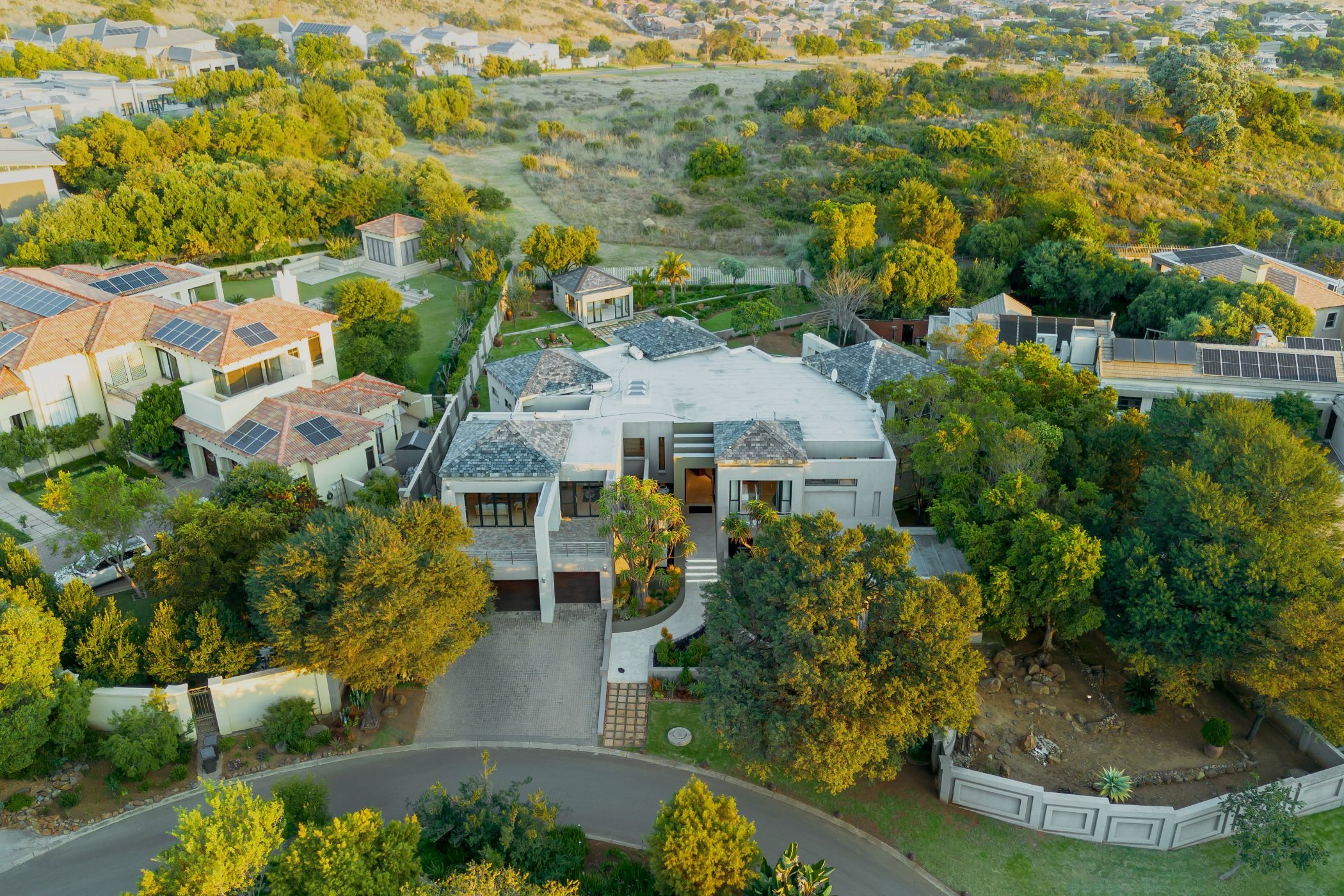 Situated on a greenbelt in prestigious Meyersdal Eco Estate, this luxury property comprises a seven-bedroom, multi-level mansion and two spacious flatlets, each with its own separate entrance, ideal for family or visitors, or to generate rental income. Priced at R15.95 million through Pam Golding Properties, the property includes a heated rim-flow swimming pool, spacious entertainment area, landscaped garden, inverters and batteries, home automation, air conditioning, underfloor heating, domestic accommodation, storage rooms and four-car garage, among other features. Situated on a greenbelt in prestigious Meyersdal Eco Estate, this luxury property comprises a seven-bedroom, multi-level mansion and two spacious flatlets, each with its own separate entrance, ideal for family or visitors, or to generate rental income. Priced at R15.95 million through Pam Golding Properties, the property includes a heated rim-flow swimming pool, spacious entertainment area, landscaped garden, inverters and batteries, home automation, air conditioning, underfloor heating, domestic accommodation, storage rooms and four-car garage, among other features.