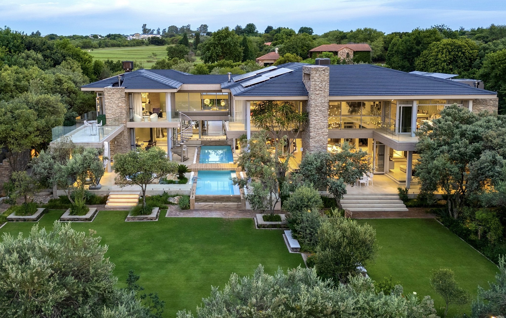 Priced at R67 million through Pam Golding Properties – including the entire household contents – this six-bedroom, double-storey home set on a stand of 2996sqm is one of the signature properties in highly acclaimed Blair Atholl Golf and Equestrian Estate. With views over the mountains, river and golf course, this impressive 1600sqm mansion built with natural materials and state-of-the-art finishes creates a sense of relaxed modernity with versatile accommodation flowing seamlessly over multiple levels. The property includes staff accommodation comprising two bedrooms and one bathroom. Priced at R67 million through Pam Golding Properties – including the entire household contents – this six-bedroom, double-storey home set on a stand of 2996sqm is one of the signature properties in highly acclaimed Blair Atholl Golf and Equestrian Estate. With views over the mountains, river and golf course, this impressive 1600sqm mansion built with natural materials and state-of-the-art finishes creates a sense of relaxed modernity with versatile accommodation flowing seamlessly over multiple levels. The property includes staff accommodation comprising two bedrooms and one bathroom.