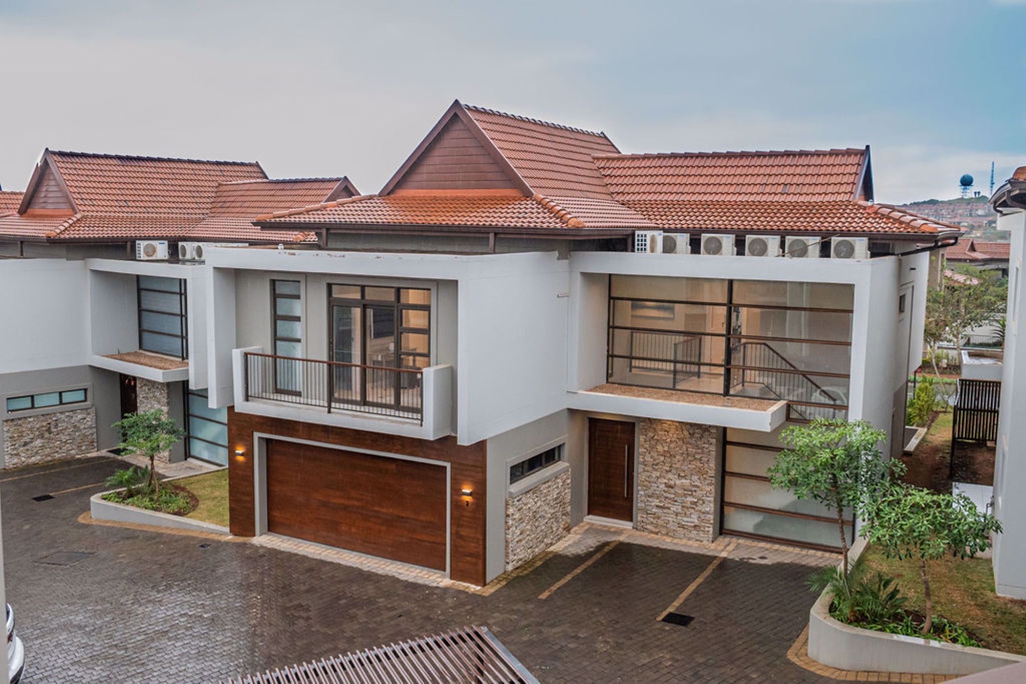 This four-bedroom, three-bathroom townhouse in centrally located Izinga Ridge gated estate is marketed by Pam Golding Properties for R6.4 million and has an open plan kitchen and living area leading onto an appealing undercover patio. Pet-friendly, it includes a double garage, air conditioning and state of the art finishes. The Izinga Ridge development comprises 12 freestanding units and a block of apartments, and includes a pool, 24-hour guarded entrance and ample visitors’ parking bays. This four-bedroom, three-bathroom townhouse in centrally located Izinga Ridge gated estate is marketed by Pam Golding Properties for R6.4 million and has an open plan kitchen and living area leading onto an appealing undercover patio. Pet-friendly, it includes a double garage, air conditioning and state of the art finishes. The Izinga Ridge development comprises 12 freestanding units and a block of apartments, and includes a pool, 24-hour guarded entrance and ample visitors’ parking bays.