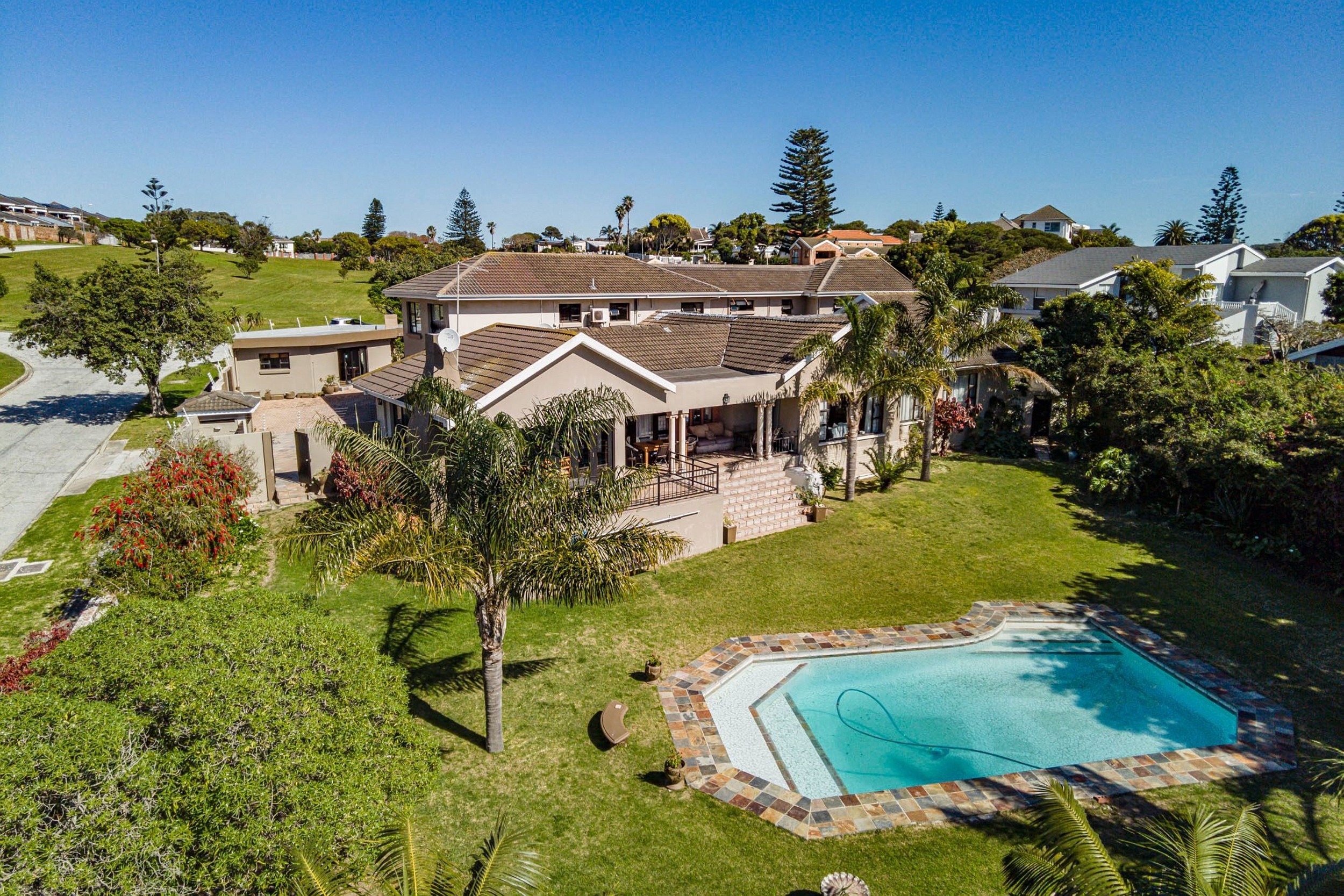 Well situated in the tranquil suburb of Humewood, Gqeberha – just 300m from Humewood Beach and in close proximity to appealing parkland – this eight-room, 4 Star, guest lodge is priced at R7 million through Pam Golding Properties. Offering self-catering bed and breakfast accommodation, the rooms are well appointed, each with en suite bathrooms and fully-equipped kitchenettes. Modern amenities include Satellite TV and Wi-Fi and secure off-street parking. A well-maintained four-bedroom house is part of this extensive property, overlooking a treed garden and pool. Well situated in the tranquil suburb of Humewood, Gqeberha – just 300m from Humewood Beach and in close proximity to appealing parkland – this eight-room, 4 Star, guest lodge is priced at R7 million through Pam Golding Properties. Offering self-catering bed and breakfast accommodation, the rooms are well appointed, each with en suite bathrooms and fully-equipped kitchenettes. Modern amenities include Satellite TV and Wi-Fi and secure off-street parking. A well-maintained four-bedroom house is part of this extensive property, overlooking a treed garden and pool.