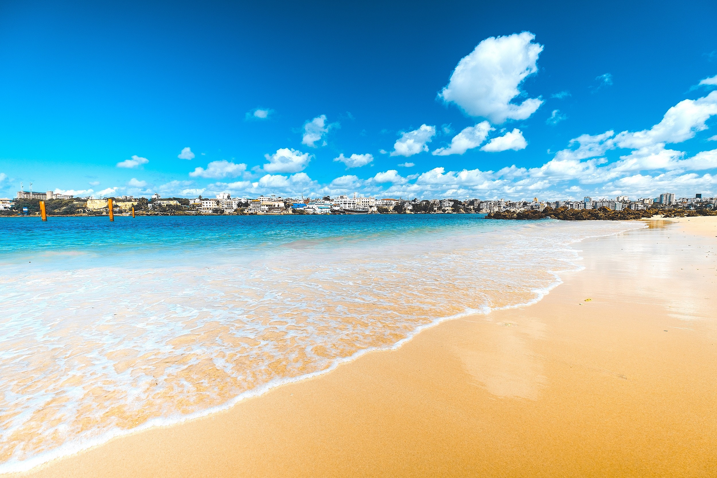 View of the beach with Mombasa skyline in the distance. View of the beach with Mombasa skyline in the distance.