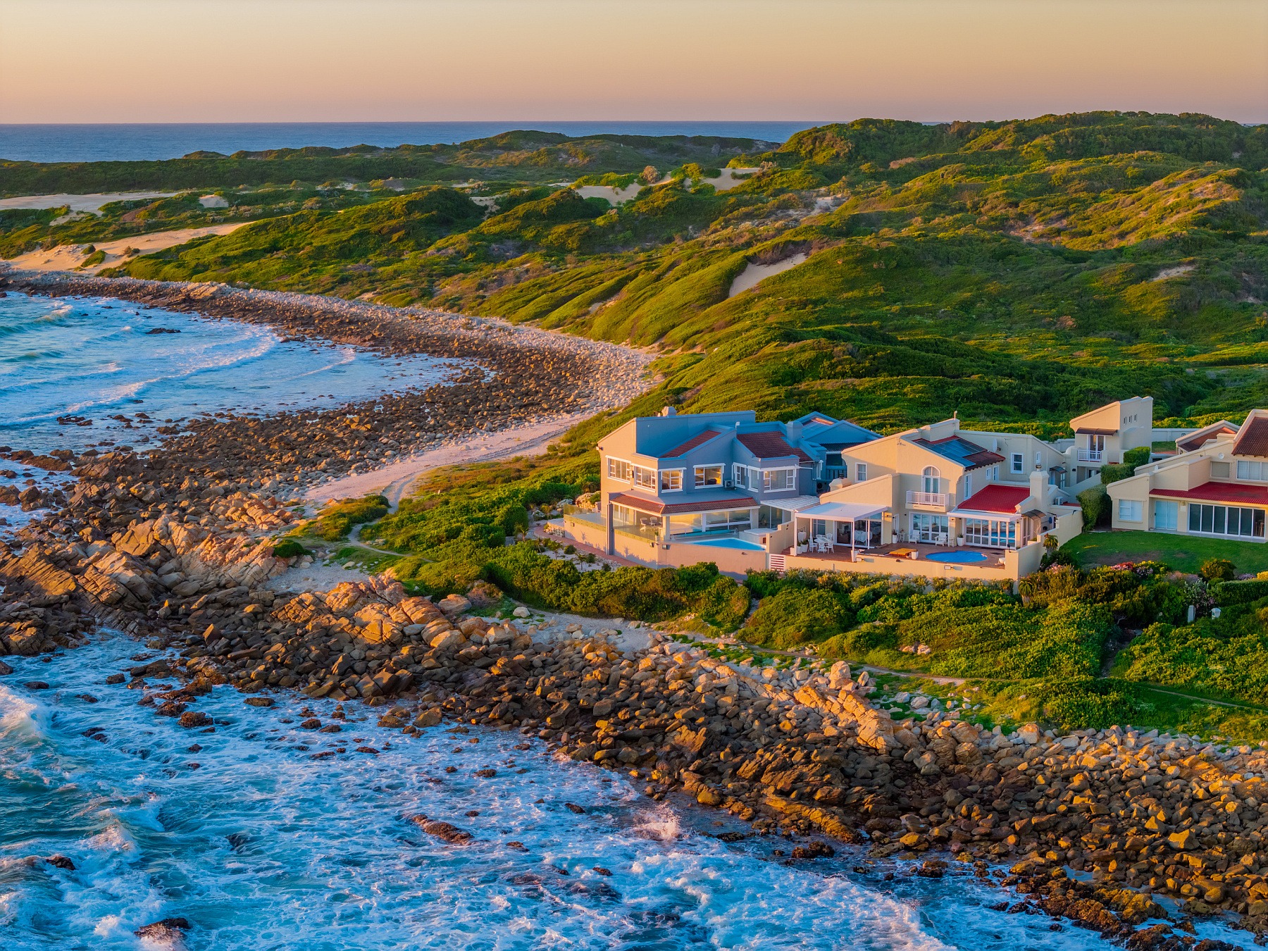 Located in arguably the best position in the Eastern Cape, this north-facing coastal home in sought-after Otters Landing Estate in St Francis Bay, borders a nature reserve stretching to Shark Point. Besides all the usual attributes of a modern home, it also features a heated pool and jacuzzi, and fishing from your patio, plus all the nature and outdoor activities on your doorstep. This property is priced at R19.49 million through Pam Golding Properties. Located in arguably the best position in the Eastern Cape, this north-facing coastal home in sought-after Otters Landing Estate in St Francis Bay, borders a nature reserve stretching to Shark Point. Besides all the usual attributes of a modern home, it also features a heated pool and jacuzzi, and fishing from your patio, plus all the nature and outdoor activities on your doorstep. This property is priced at R19.49 million through Pam Golding Properties.