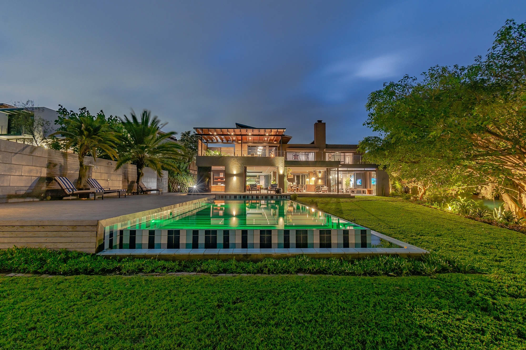 Situated on a double stand and designed by renowned architect Stefan Antoni, this luxurious, contemporary home in Hawaan Forest Estate in uMhlanga offers relaxation and tranquillity. Priced at R24.95 million through Pam Golding Properties, the front facade incorporates vast custom-made glass sliding doors allowing for a seamless flow from all the reception rooms to the outdoors, with the extended undercover patio providing dining and lounging areas, plus a built-in gas braai and billiard room. Situated on a double stand and designed by renowned architect Stefan Antoni, this luxurious, contemporary home in Hawaan Forest Estate in uMhlanga offers relaxation and tranquillity. Priced at R24.95 million through Pam Golding Properties, the front facade incorporates vast custom-made glass sliding doors allowing for a seamless flow from all the reception rooms to the outdoors, with the extended undercover patio providing dining and lounging areas, plus a built-in gas braai and billiard room.