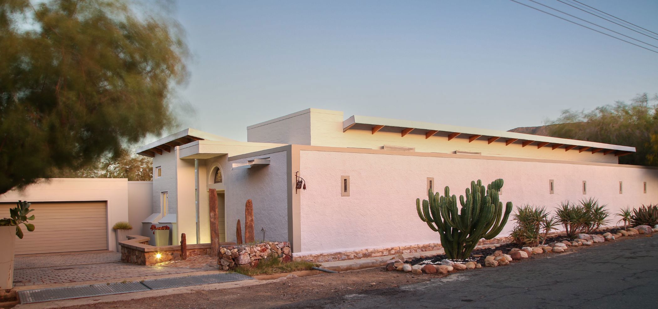 Priced at R5.75 million through Pam Golding Properties, this eclectic and stylish three-bedroom home in Prince Albert is in a league of its own. The living areas are minimalist in design, with a series of sliding doors leading to the covered veranda and a courtyard-style garden with splash pool.