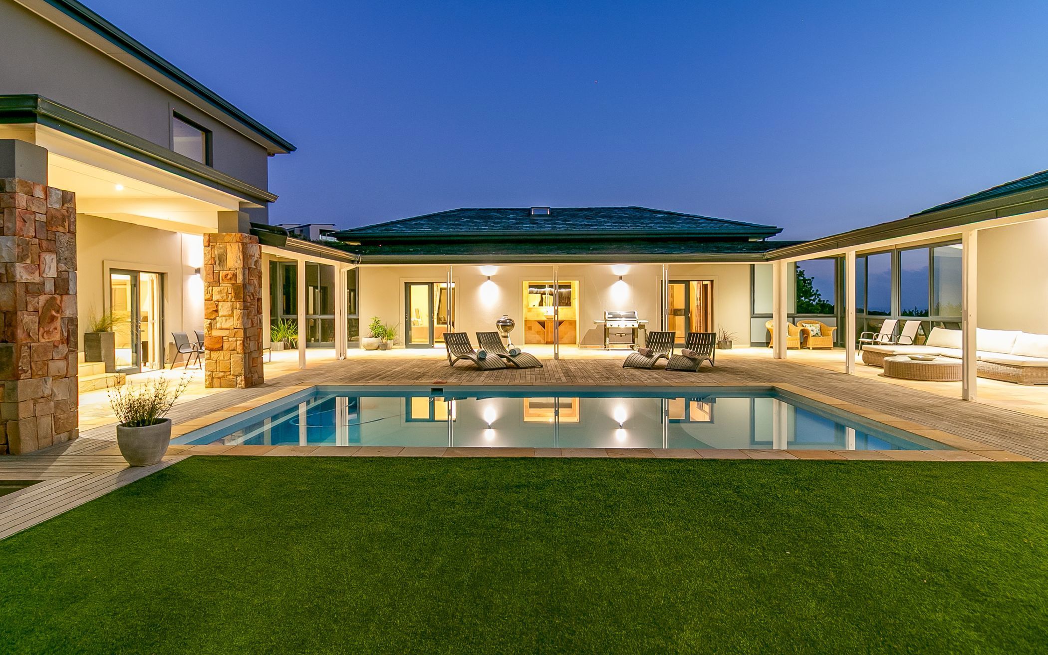 Ideally positioned in Phase 1 of Pezula Private Estate, this exceptional seven-bedroom contemporary home with three independent guest suites offers privacy, space, and elevated coastal living. At the heart of the property is the central swimming pool, and all living areas and the modern kitchen seamlessly connect to a covered patio, with dramatic views of the ocean and rugged cliffs. The property is marketed by Pam Golding Properties at R25 million. 