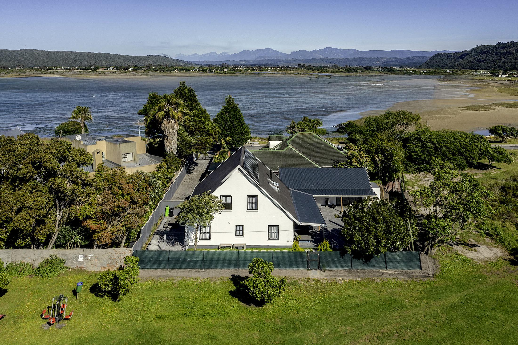 Situated in a tranquil location in the heart of Sedgefield, this luxurious five-bedroom, double-storey house is just a short stroll from the banks of the lagoon. Priced at R5.86 million through Pam Golding Properties, the property includes a swimming pool, expansive views, and for sustainable living, 12 solar panels, an 8Kw inverter and batteries, two gas geysers and a borehole-fed irrigation system. 