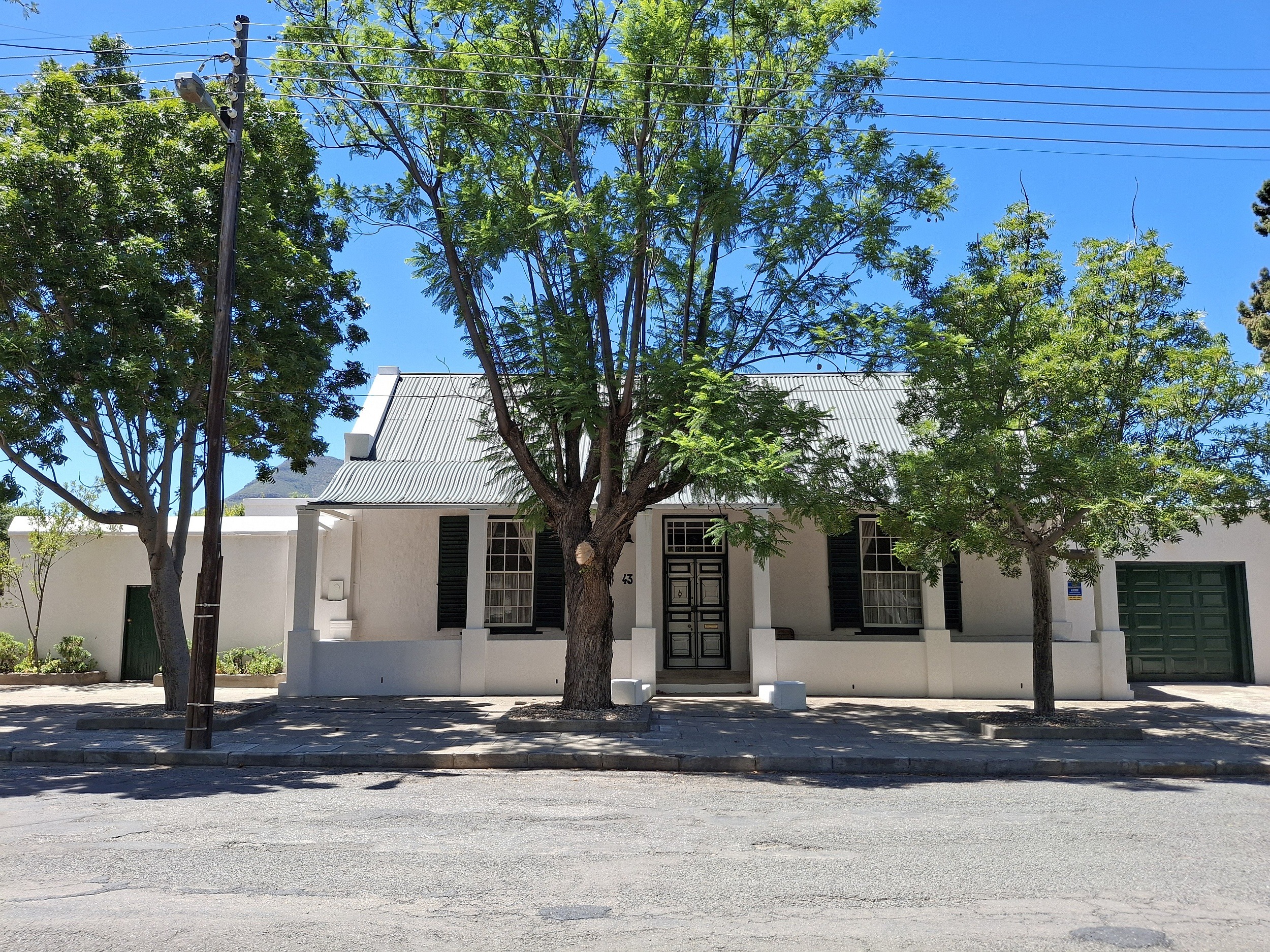 Priced at R2.995 million through Pam Golding Properties, this beautifully renovated, three-bedroom, two-bathroom Karoo home is in a sought-after area in Graaff-Reinet. Original Yellowwood and Oregon pine features, high ceilings and sash windows add to the charm of this character home. With a spacious open-plan lounge, covered patio overlooking the lush garden and mountain in the distance, the property includes water tanks with a pressure pump and sprinkler system, as well as a garage with automated door. Priced at R2.995 million through Pam Golding Properties, this beautifully renovated, three-bedroom, two-bathroom Karoo home is in a sought-after area in Graaff-Reinet. Original Yellowwood and Oregon pine features, high ceilings and sash windows add to the charm of this character home. With a spacious open-plan lounge, covered patio overlooking the lush garden and mountain in the distance, the property includes water tanks with a pressure pump and sprinkler system, as well as a garage with automated door.