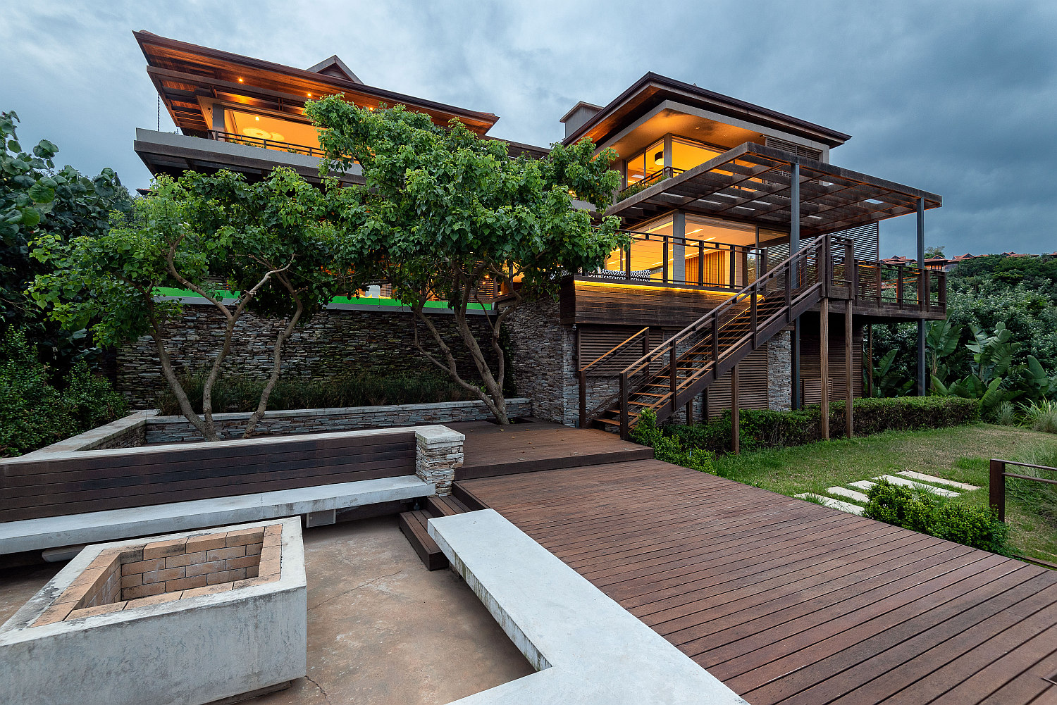 Located in Zimbali Estate, just a few metres from the beach, this recently completed, upmarket four-bedroom, four-bathroom home is elevated with panoramic views. Priced at R17.5 million through Pam Golding Properties, its expansive open-plan and partly double-volume interior reception, kitchen and family areas, and tranquil exterior spaces, complement the home's scenic coastal setting. 