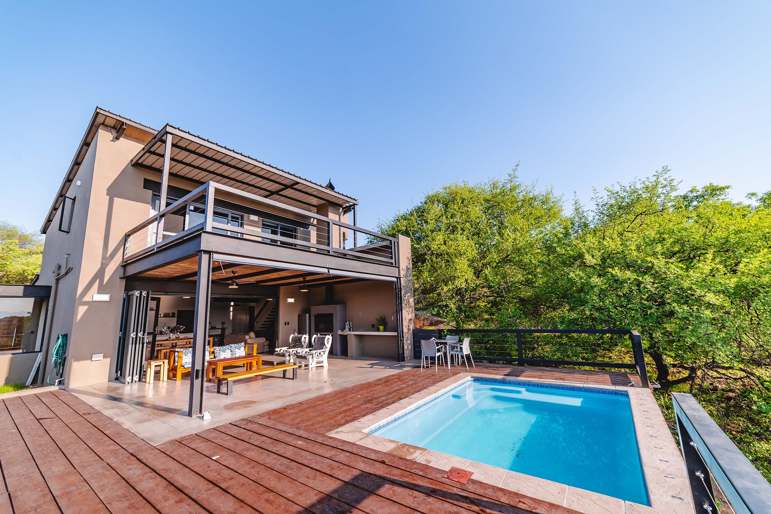 Located in pet-friendly Elephant Rock Eco Estate, this ultra-modern, two-bedroom home is priced at R4.95 million through Pam Golding Properties. Offering off the grid eco-living, this home is in perfect harmony with its surrounds, with exceptional views of the escarpment from two different level, spacious decks and a large covered patio overlooking the swimming pool. With approved plans for an additional two rooms, the completed home is currently just over 400sqm. Double carports, courtyard, scullery, laundry, storeroom and solar ready, it is situated on the banks of the Olifants River with spectacular views of the Drakensberg Mountains and a host of leisure activities. Located in pet-friendly Elephant Rock Eco Estate, this ultra-modern, two-bedroom home is priced at R4.95 million through Pam Golding Properties. Offering off the grid eco-living, this home is in perfect harmony with its surrounds, with exceptional views of the escarpment from two different level, spacious decks and a large covered patio overlooking the swimming pool. With approved plans for an additional two rooms, the completed home is currently just over 400sqm. Double carports, courtyard, scullery, laundry, storeroom and solar ready, it is situated on the banks of the Olifants River with spectacular views of the Drakensberg Mountains and a host of leisure activities.