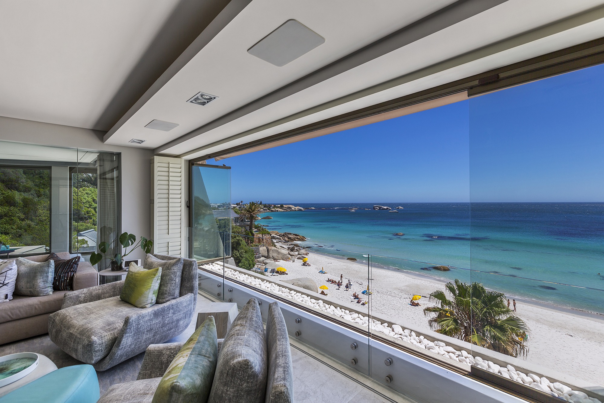 Acquired by a local buyer for R55 million, this exclusive apartment is situated on the white sands of Second Beach, Cape Town. The luxurious apartment extends over the entire floor and has been completely re-built and re-designed by Stefan Antoni architects, with superior finishes, spacious open plan living areas with glass folding doors and wrap-around windows leading to a private terrace with a rim-flow pool. There are only six apartments in the building, all with private and direct elevator access. Acquired by a local buyer for R55 million, this exclusive apartment is situated on the white sands of Second Beach, Cape Town. The luxurious apartment extends over the entire floor and has been completely re-built and re-designed by Stefan Antoni architects, with superior finishes, spacious open plan living areas with glass folding doors and wrap-around windows leading to a private terrace with a rim-flow pool. There are only six apartments in the building, all with private and direct elevator access.
