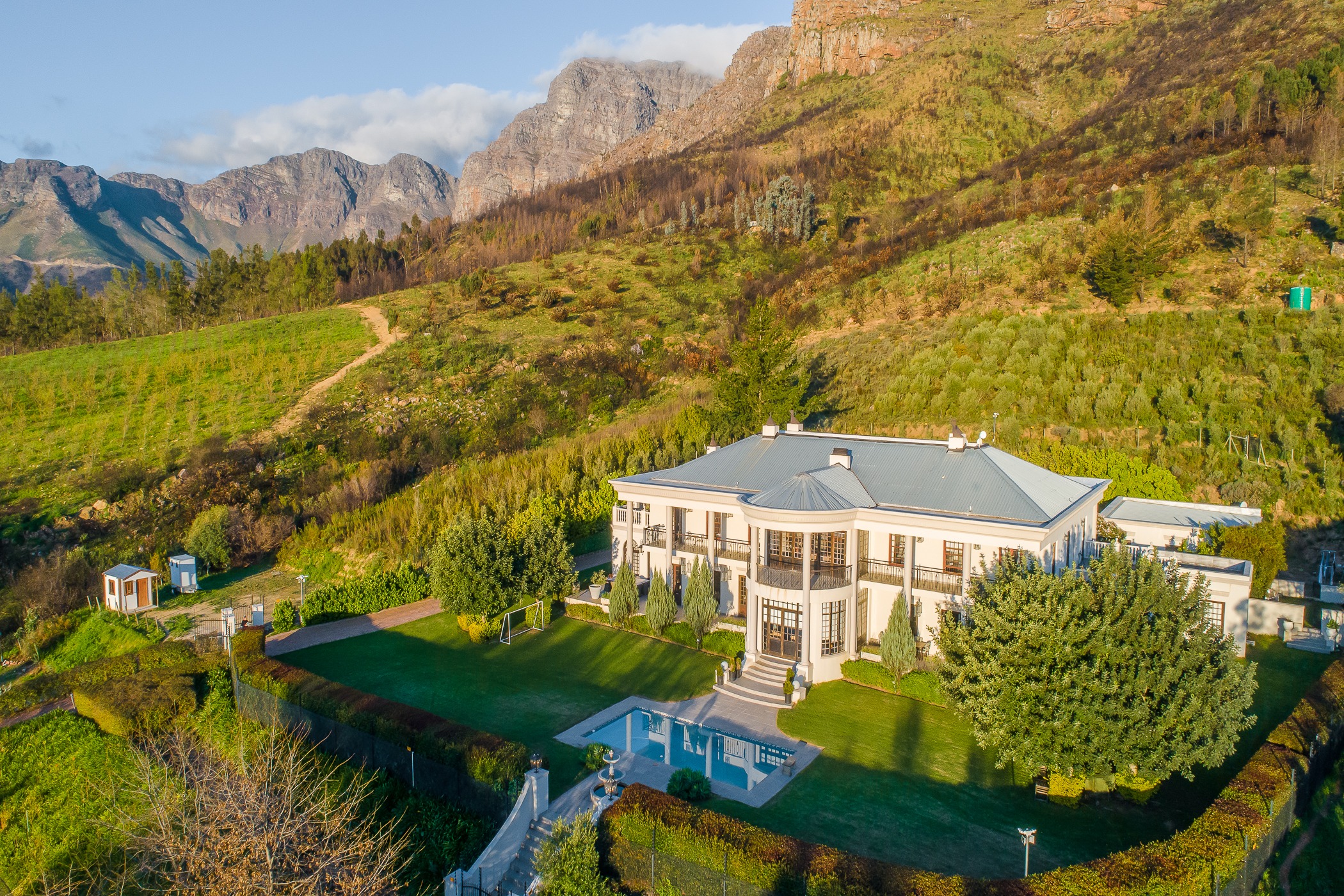 Situated near Paarl, this exceptional fruit farm with a grand homestead and additional accommodation includes Shiraz, Pinotage and Cabernet Sauvignon grapes, olives and plums and is available to purchase via Pam Golding Auctions. Situated near Paarl, this exceptional fruit farm with a grand homestead and additional accommodation includes Shiraz, Pinotage and Cabernet Sauvignon grapes, olives and plums and is available to purchase via Pam Golding Auctions.