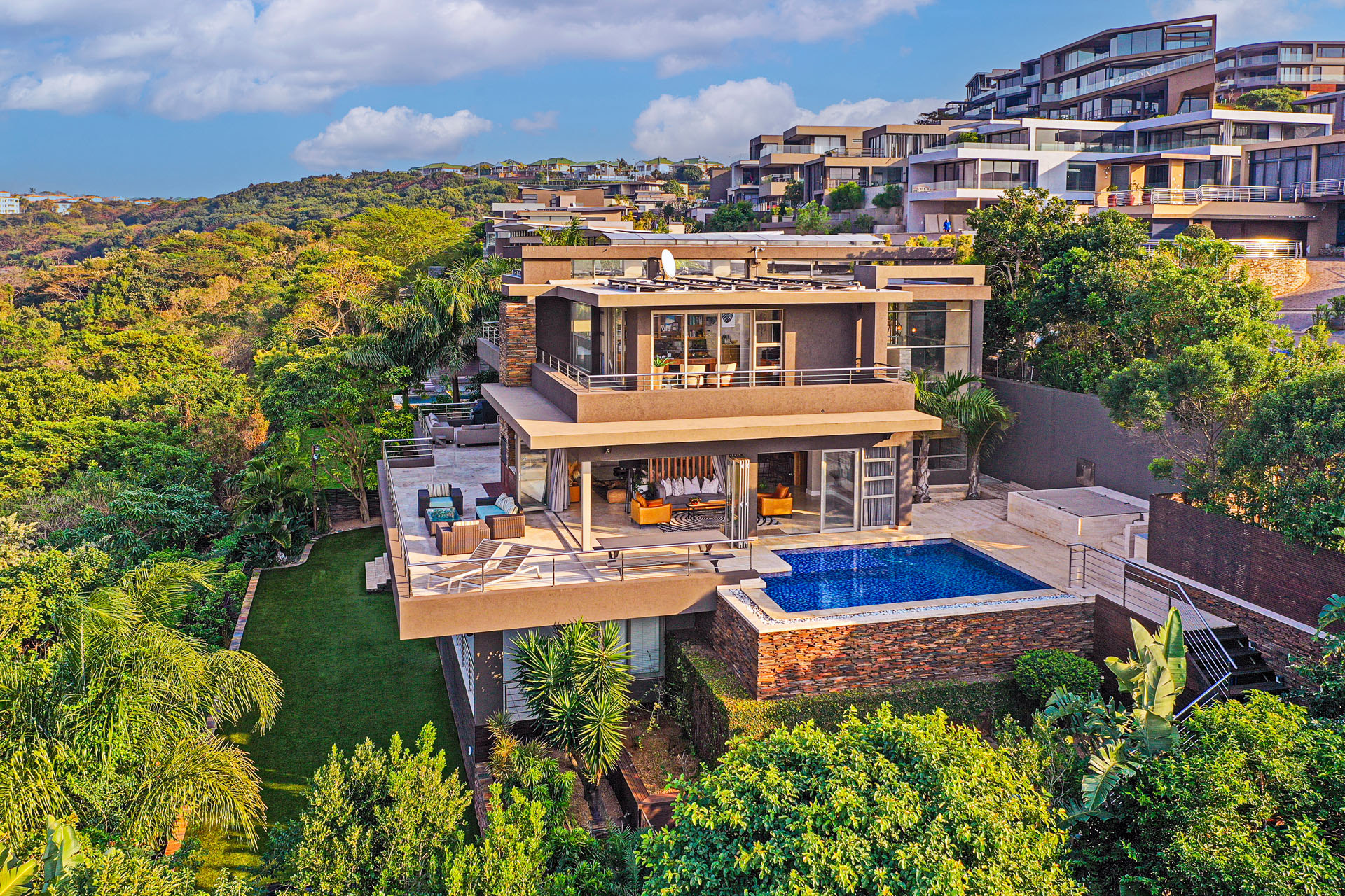 Marketed at R18 million through Pam Golding Properties, this luxury, six-bedroom mansion is situated in prime, front-row position in one of KZN&rsquo;s most sought after security estates, with uninterrupted sea, forest and city views. 